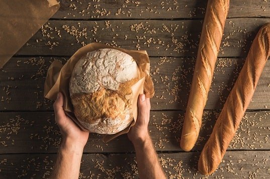 Man Holding Bread Loaf Two Hands